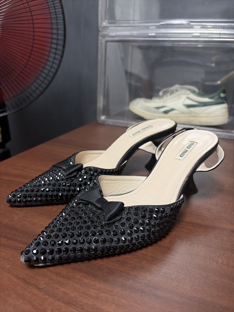 Miu Miu Embellished Slingback Heels (Category: Heels) located in Davao. Submitted by benjhmaquiran (Listing ID 1438618469, Image 1). Description: - Miu Miu slingback heels - Size 36 - Pointed toe design - All-over embellishments - Bow detail - Miu Miu logo on insole - Made in Italy.