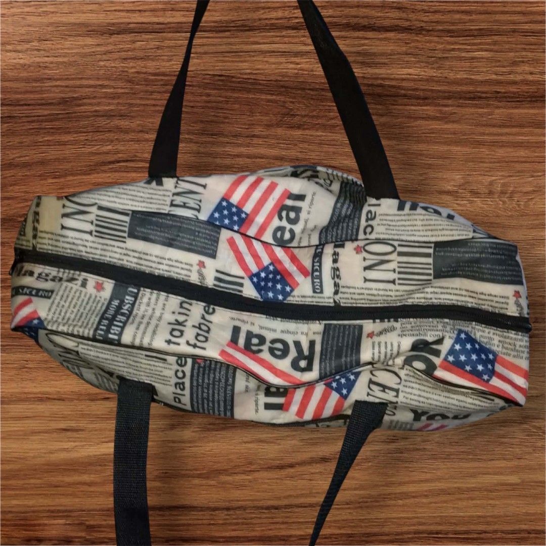 Newspaper Print Travel Weekender Bag (Category: Beach Bags) located in Cebu City. Submitted by jc_online_shop (Listing ID 1438690466, Image 2). Description: 24" x 18" x 8" Good for travel use nylon material zip closure.