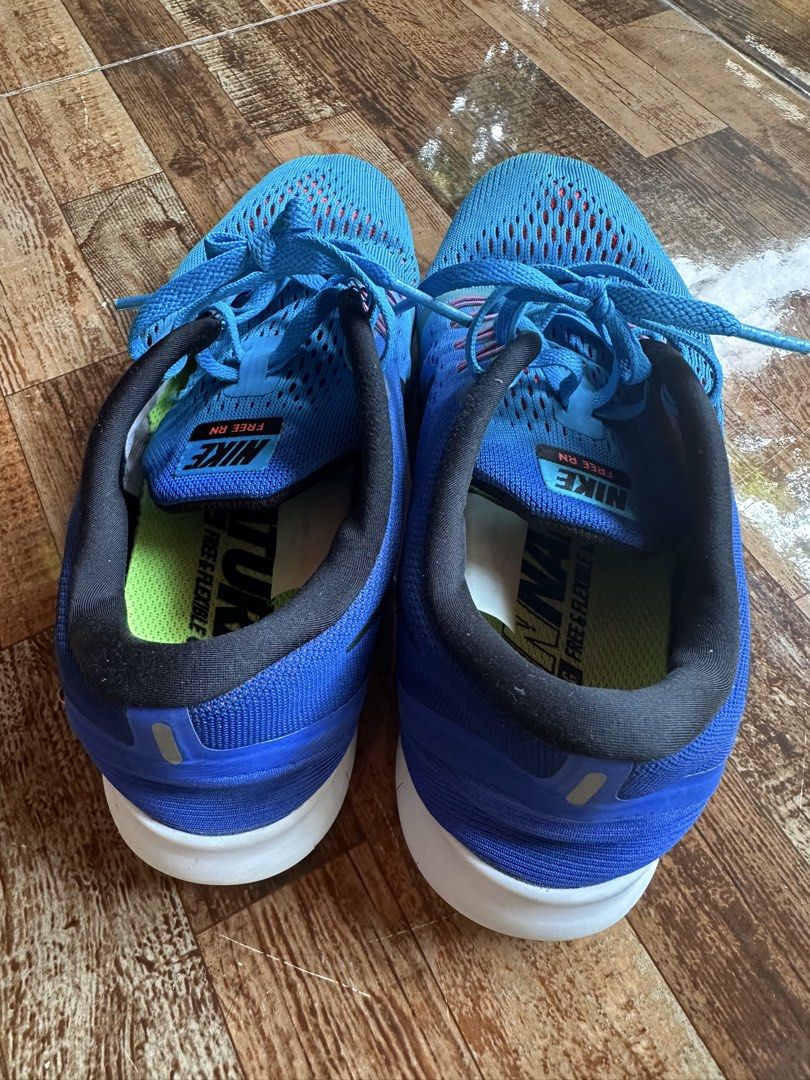 Nike Free RN Blue Running Shoes (Category: Sneakers) located in Digos. Submitted by venusacaro13427 (Listing ID 1438563241, Image 2). Description: - Blue Nike Free RN running shoes - Breathable mesh upper - White sole - Nike swoosh logo on the side - Blue laces - Black interior - Good sole condition - Designed for flexibility and comfort.