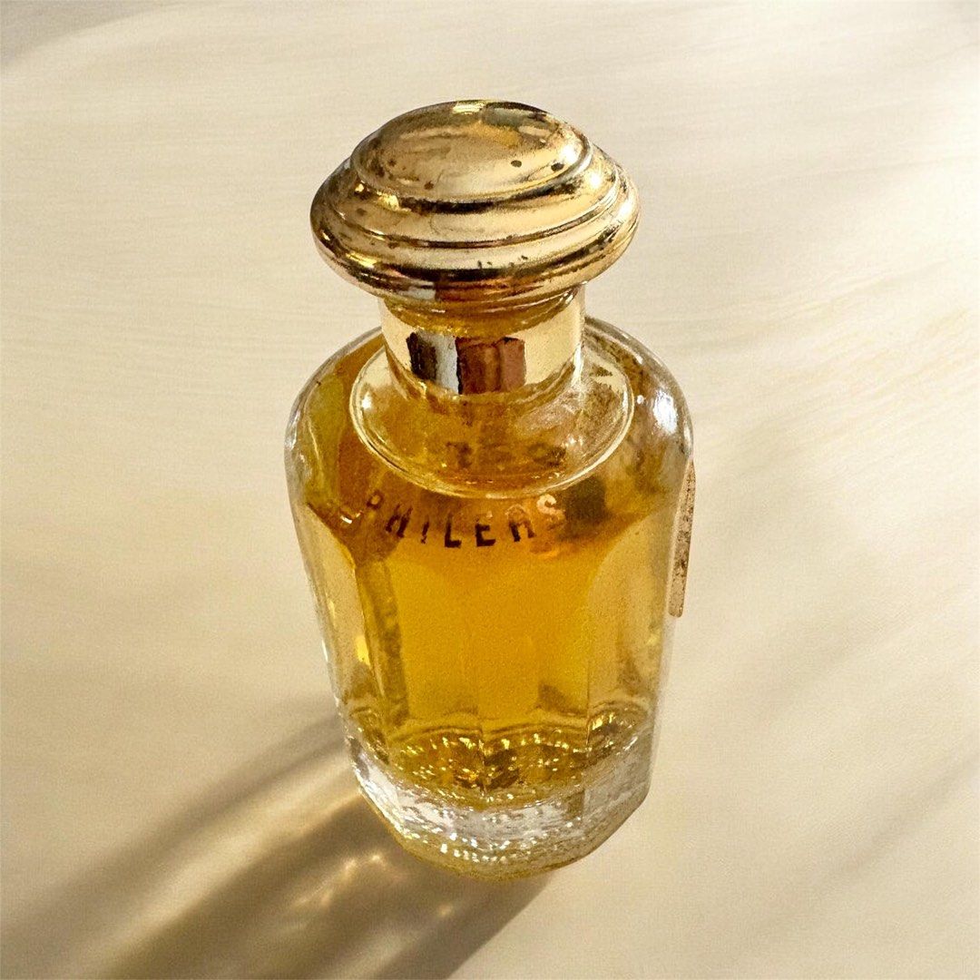 Nina Ricci Phileas Perfume (Category: Fragrance & Deodorants) located in Cebu City. Submitted by banonggio (Listing ID 1438585275, Image 2). Description: -Phileas perfume bottle - Gold-colored cap - Clear glass body - Amber-colored perfume - Unique textured base design - almost full - discontinued perfume by nina ricci.