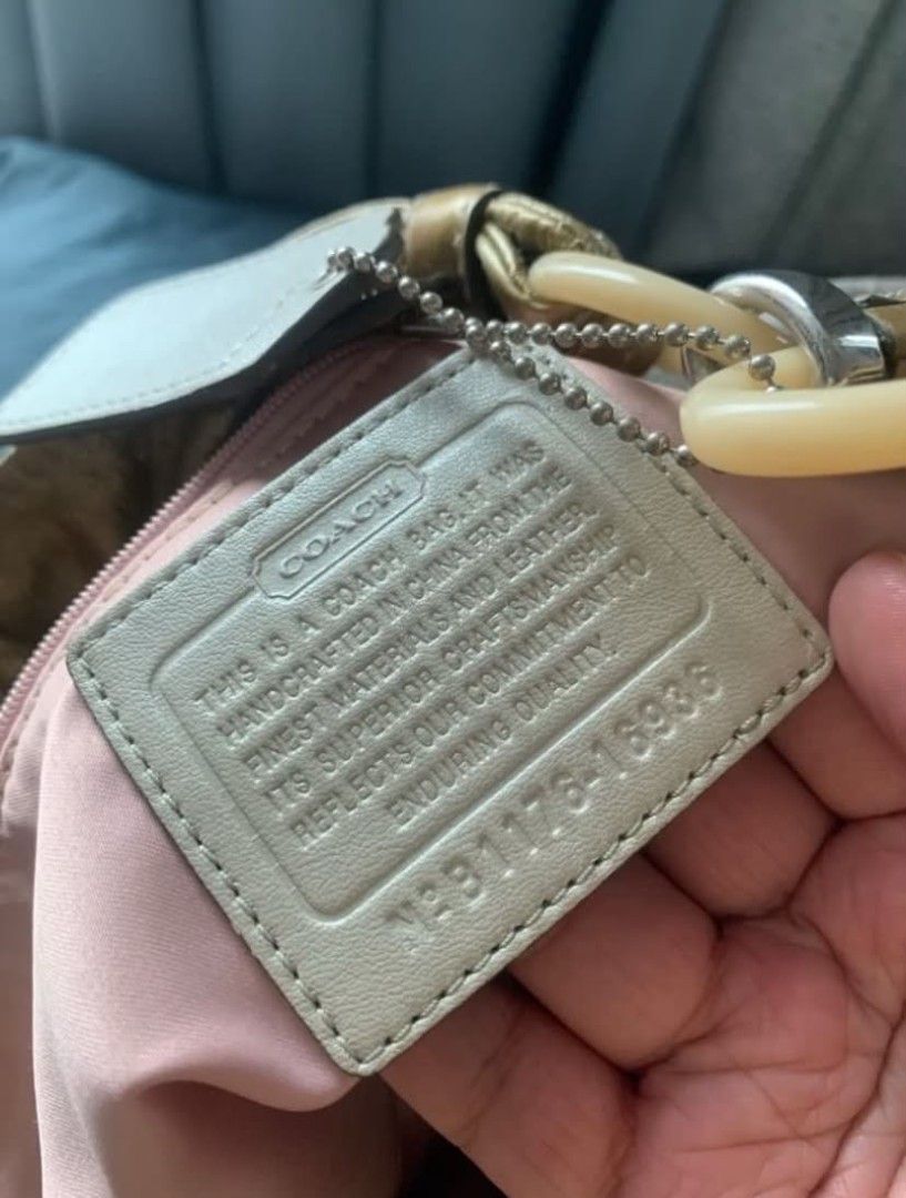 Original Coach Hobo Bag with Pattern (PAYDAY SALE) (Category: Luxury Bags & Wallets) located in Manila. Submitted by leontheexplorer (Listing ID 1438506880, Image 3). Description: - Original Coach hobo bag - Unique pattern - Spacious interior - Secure zip closure - Fabric lining - Includes Coach hangtag - Interior leather tag - Leather and light-colored handles - Multiple interior pockets for organization.