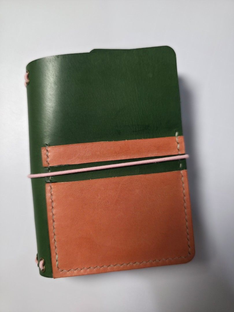 Passport size Handmade Leather Journal (Category: Stationery & School Supplies) located in Pasig City. Submitted by ajsssss (Listing ID 1438677317, Image 1). Description: 🌱 Passport Size Leather Journal Folio 🌱 🪡 Handmade - saddle stiched 🌸 3 set bronze grommet: can fit a total of 6 Passport sized paper refills 🌸 Main cover is Vegetable Tanned Malayan Leather, Pocket is Vegetable Tanned Textured Cow Leather 🔆 Order includes 2 Passport Size 