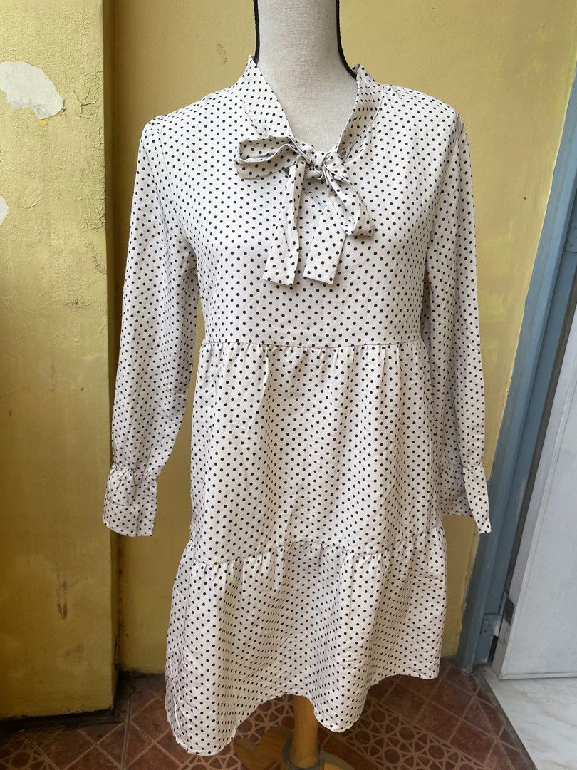Polka Dot Dress with Tie Neck (Category: Dresses) located in Pasig City. Submitted by khaleisi (Listing ID 1438689318, Image 1). Description: - Classic polka dot pattern - Tie neck detail - Long sleeves with ruffled cuffs - Tiered, flowy design - Lightweight soft nice fabric - Versatile for various occasions - Bust 40” length 33”.