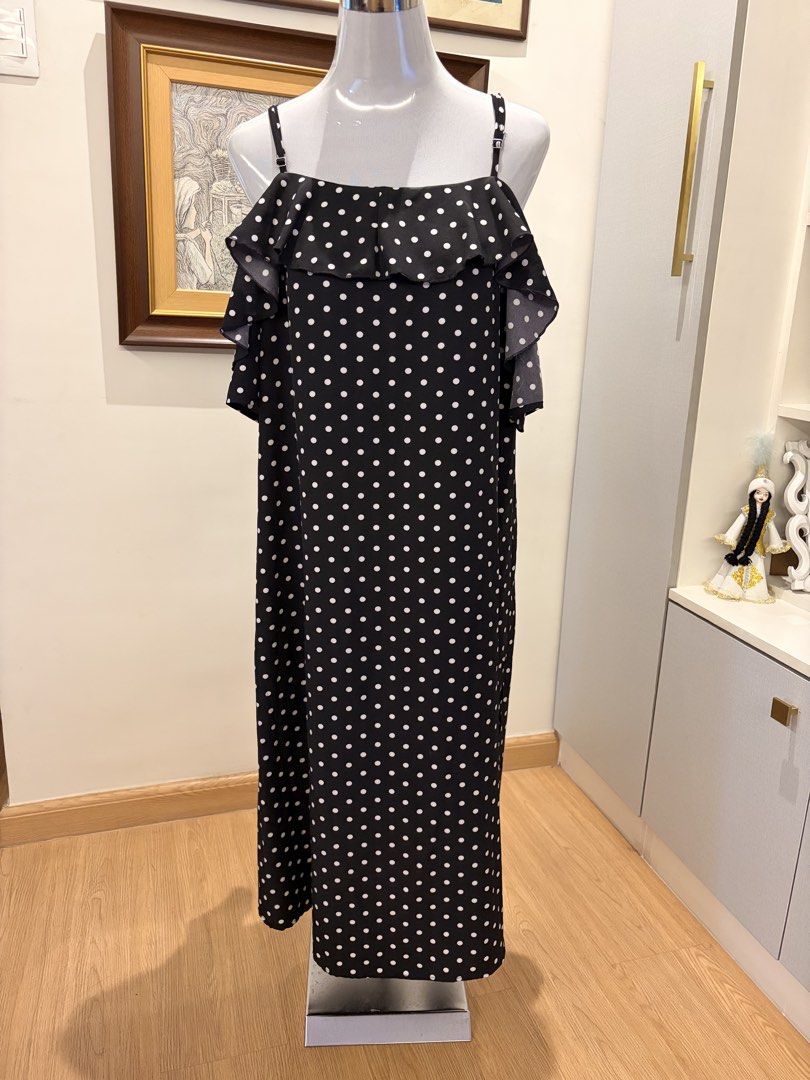 Polka Dot Off-Shoulder Dress (Category: Dresses) located in Quezon City. Submitted by ninas_preloved (Listing ID 1438620227, Image 1). Description: - Black and white polka dot pattern - Off-shoulder design - Ruffled detailing - Adjustable spaghetti straps - Midi length - Suitable for various occasions.
