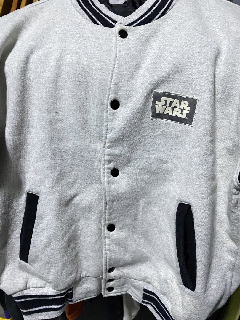 Polo by Ralph Lauren Varsity Jacket XL (Category: Coats, Jackets and Outerwear) located in Santa Ana. Submitted by tunes_vtg (Listing ID 1438597591, Image 2). Description: - Vintage Polo by Ralph Lauren varsity jacket - Features a Star Wars patch - Gray body with black sleeves and trim - Button-up front - Two front pockets - Striped detailing on collar, cuffs, and hem - Size: XL - Made in the USA - Excellent condition - Issue patch on logo on fro
