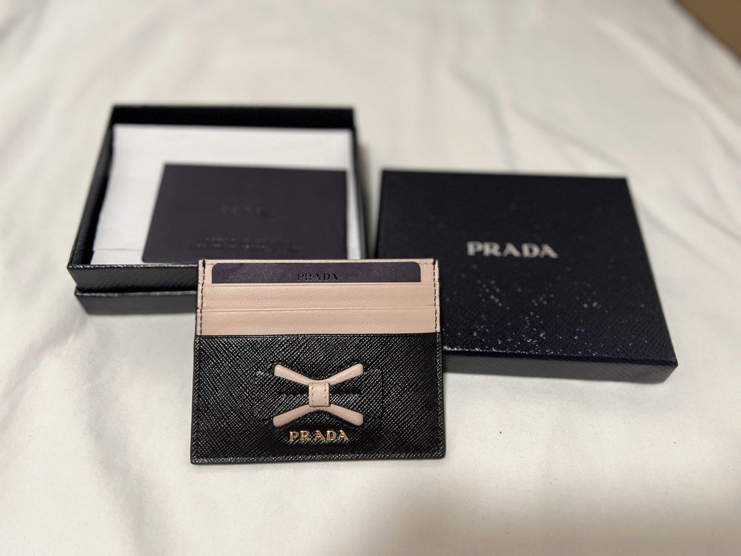 Prada card holder (Category: Luxury Bags & Wallets) located in Cabanatuan. Submitted by hellorhea (Listing ID 1438642950, Image 1). Description: Look at the top right corner. There's something lang po sa stitches nya, natanggal po ata sa katagalan. But overall it was good. .