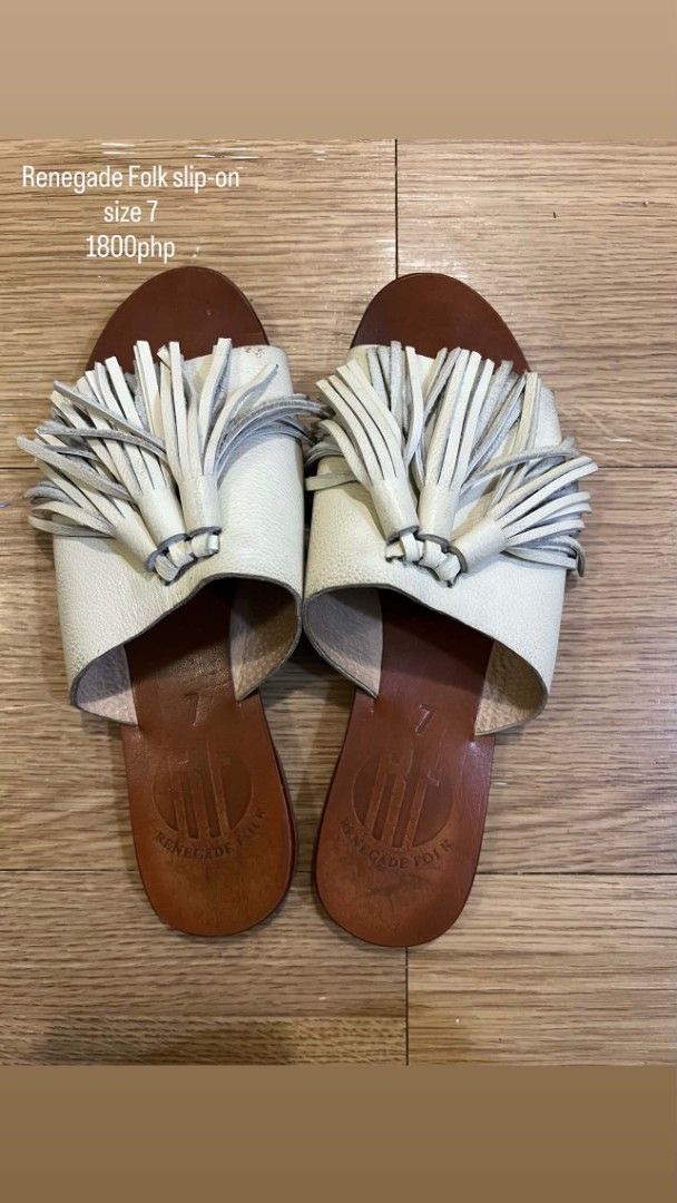 Renegade Folk Slip-on Sandals - Size 7 (Category: Flats & Sandals) located in Taguig. Submitted by andrenalin (Listing ID 1438677603, Image 1). Description: - Renegade Folk slip-on sandals - Size 7 - White upper with tassel detailing - Brown leather sole - Slip-on design - Price: PHP 1800.