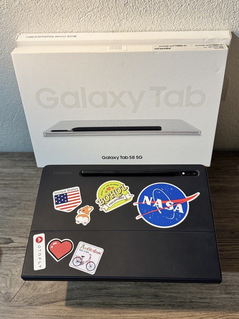 Samsung Galaxy Tab S8 5G with Keyboard (Category: Android) located in Pasig City. Submitted by lucygutz (Listing ID 1438507691, Image 1). Description: - Samsung Galaxy Tab S8 5G tablet - Silver color - Includes S Pen - Black book cover keyboard (with stickers) - Comes with the original box - Screen displays various apps RFS; got ipad.