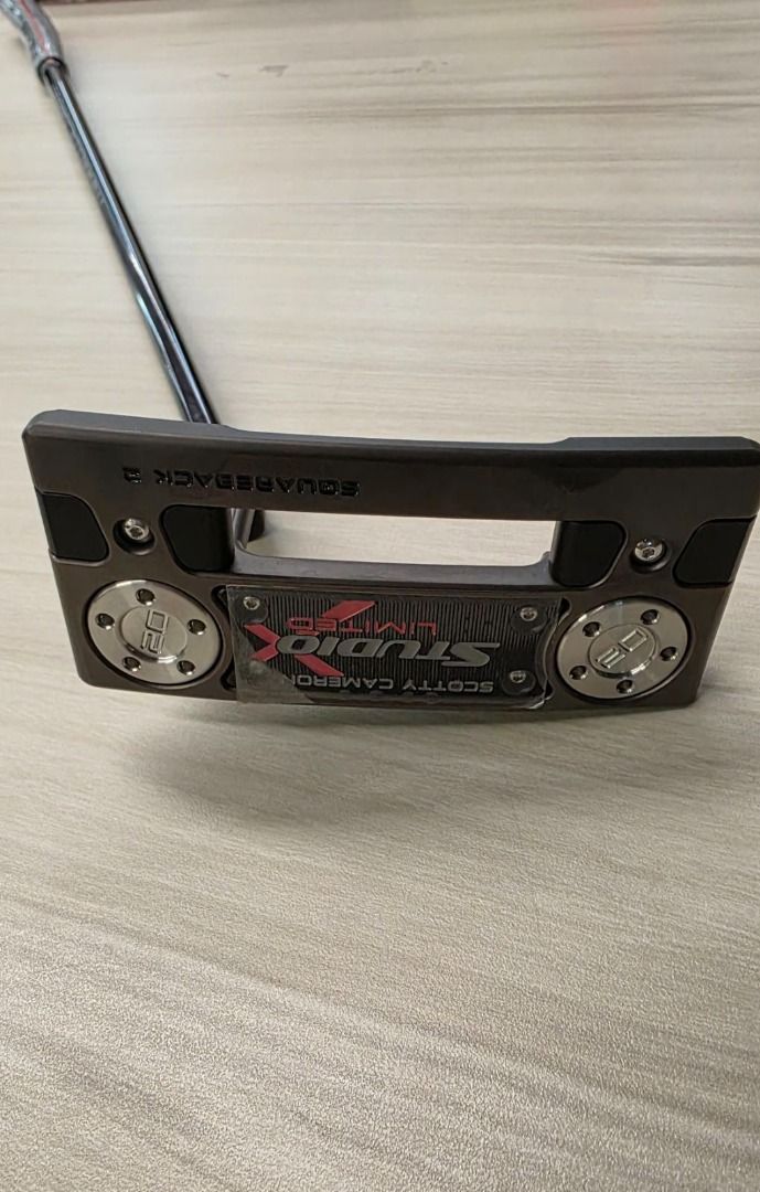 Scotty Cameron Studio Select Squareback 2 Limited Putter (Category: Golf) located in Caloocan City. Submitted by happy_awesomefinds (Listing ID 1438551111, Image 2). Description: - Scotty Cameron Studio Select Squareback 2 Limited putter. - Sleek design with a distinctive head shape. - Features a black shaft. - Includes headcover with Scotty Cameron logo. - Face branding: Studio Select and Limited..