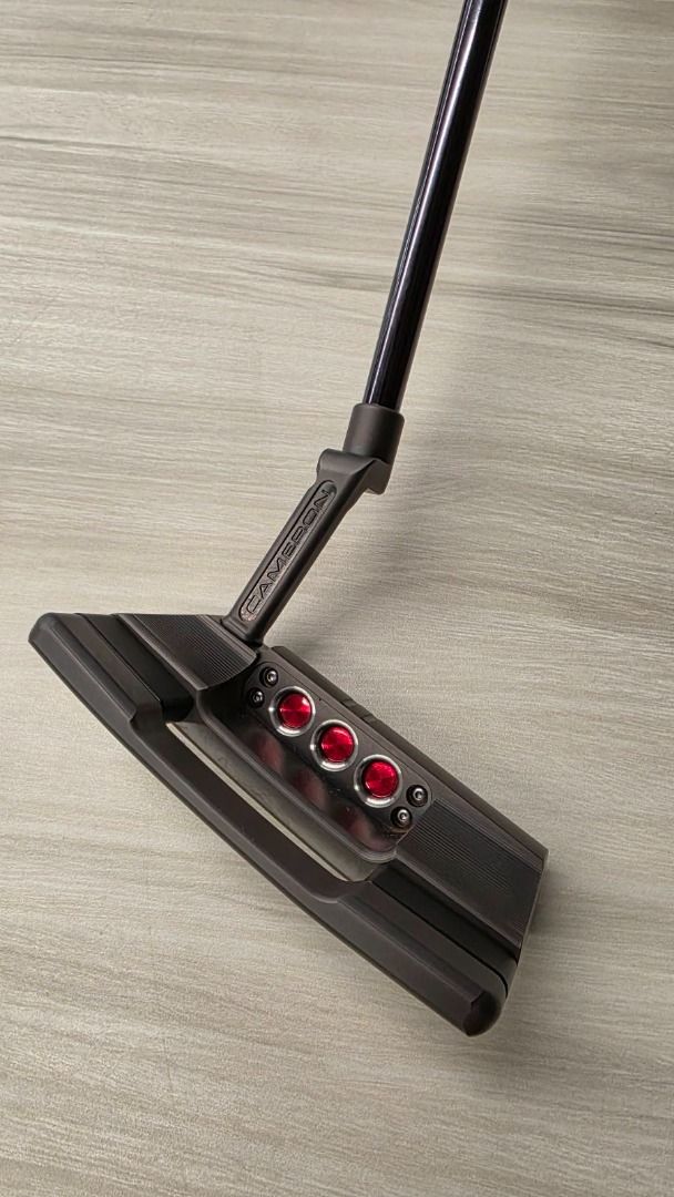 Scotty Cameron Studio Select Squareback 2 Limited Putter (Category: Golf) located in Caloocan City. Submitted by happy_awesomefinds (Listing ID 1438551111, Image 3). Description: - Scotty Cameron Studio Select Squareback 2 Limited putter. - Sleek design with a distinctive head shape. - Features a black shaft. - Includes headcover with Scotty Cameron logo. - Face branding: Studio Select and Limited..