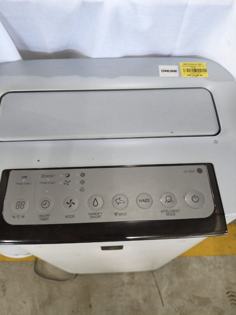 Sharp Air Purifier KC-G60E (Category: Air Purifiers & Dehumidifiers) located in Manila. Submitted by hmrgrace5. (Listing ID 1438510891, Image 2). Description: - Sharp KC-G60E Air Purifier - Color: White and Gray - Features: - Multiple function buttons (Mode, Humidity, Spot, Haze, Intelligent Air) - On/Off Timer - Fan Speed Control - Digital Display - Top Air Vent.