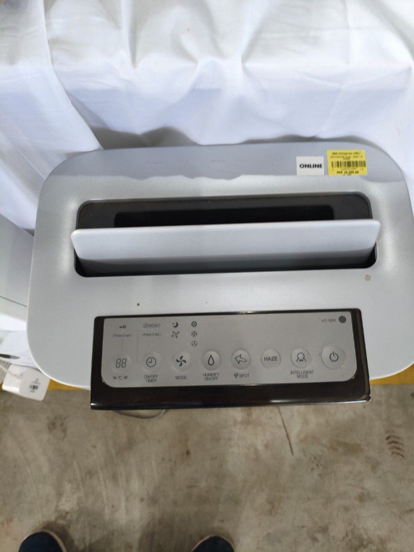 Sharp Air Purifier KC-G60E (Category: Air Purifiers & Dehumidifiers) located in Manila. Submitted by hmrgrace5. (Listing ID 1438510891, Image 3). Description: - Sharp KC-G60E Air Purifier - Color: White and Gray - Features: - Multiple function buttons (Mode, Humidity, Spot, Haze, Intelligent Air) - On/Off Timer - Fan Speed Control - Digital Display - Top Air Vent.