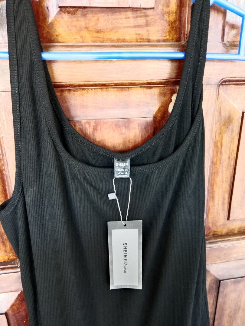 SHEIN Ribbed Tank Dress (Category: Dresses) located in Oras. Submitted by preloved4less88 (Listing ID 1438503967, Image 2). Description: - SHEIN black tank dress - Ribbed top - Flowy skirt - Midi length -used once -no more tags - Scoop neckline - Versatile for casual or dressy wear.