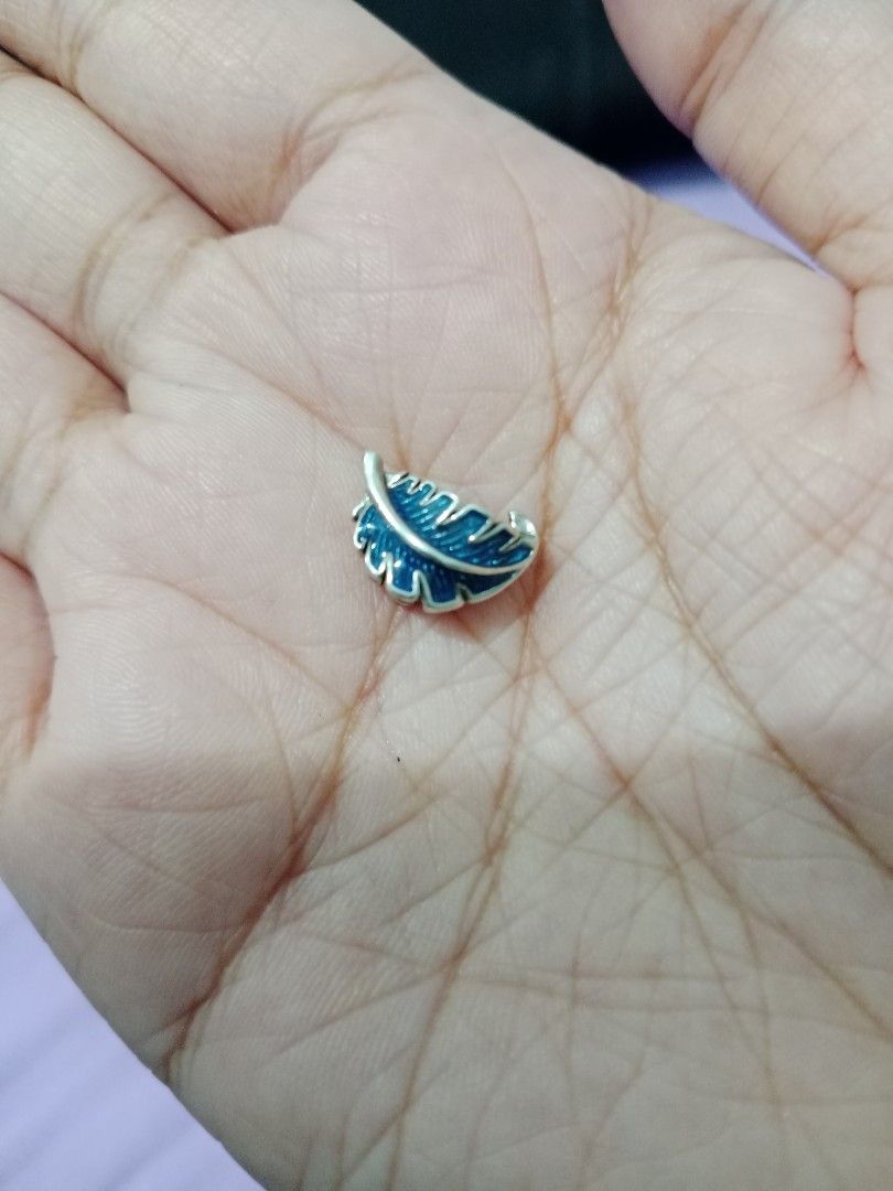 Pandora Charms - Heart and Feather (Category: Charms) located in Cabuyao City. Submitted by jcbc0120 (Listing ID 1438597766, Image 3). Description: -Heart charm sold❌ - Set includes two silver charms. - Designs: heart with star and blue feather. - Suitable for bracelets or necklaces. - Small and detailed. - Polished finish..