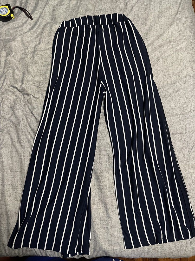 Slit Striped Wide Leg Pants (Category: Other Bottoms) located in Quezon City. Submitted by listless32 (Listing ID 1438690958, Image 2). Description: Waist 24 to 30 L is 37 Navy and white striped wide-leg pants. Features elastic waistband and side slits. Relaxed fit, lightweight fabric. Size S. Stylish and comfortable..