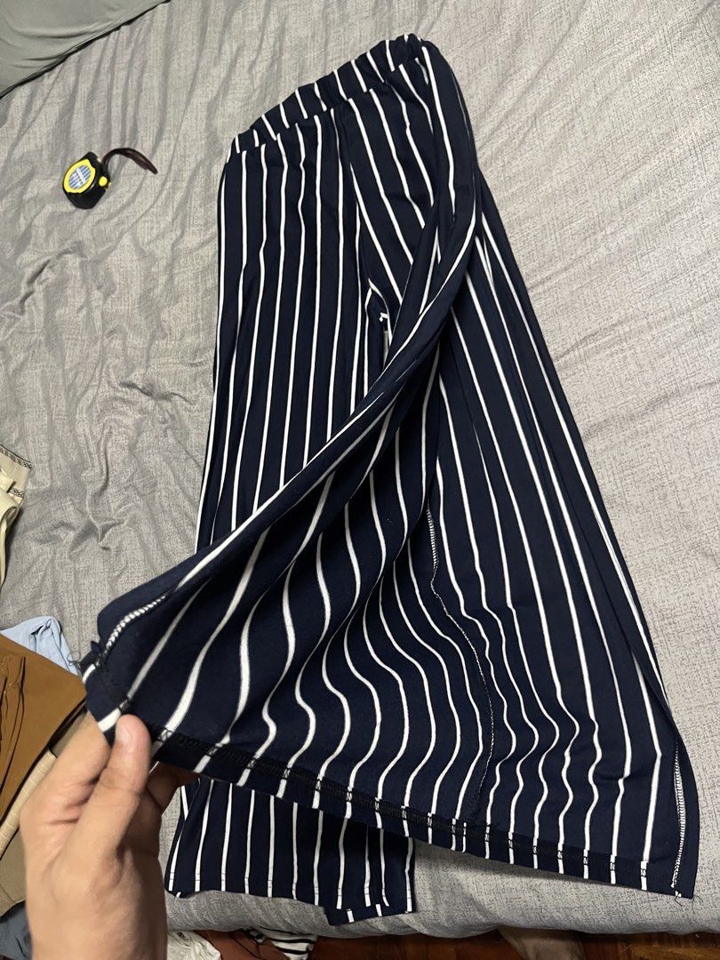 Slit Striped Wide Leg Pants (Category: Other Bottoms) located in Quezon City. Submitted by listless32 (Listing ID 1438690958, Image 3). Description: Waist 24 to 30 L is 37 Navy and white striped wide-leg pants. Features elastic waistband and side slits. Relaxed fit, lightweight fabric. Size S. Stylish and comfortable..