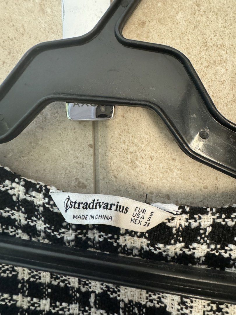 Stradivarius Tweed Vest - Size S (Category: Sleeveless) located in Manila. Submitted by archiiives (Listing ID 1438556268, Image 3). Description: - Stradivarius tweed vest - Black and white checkered pattern - V-neck design with fringe detailing - Size S - Made in China - Great for layering - Chic and stylish.