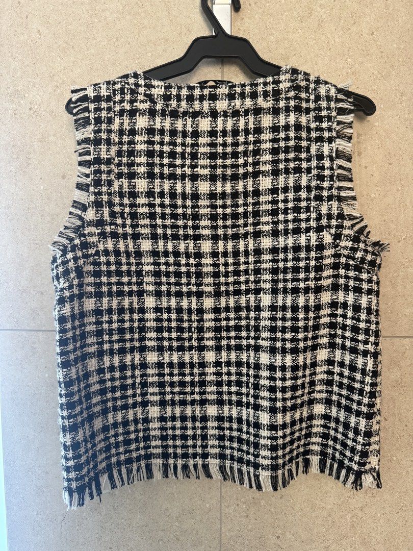 Stradivarius Tweed Vest - Size S (Category: Sleeveless) located in Manila. Submitted by archiiives (Listing ID 1438556268, Image 2). Description: - Stradivarius tweed vest - Black and white checkered pattern - V-neck design with fringe detailing - Size S - Made in China - Great for layering - Chic and stylish.