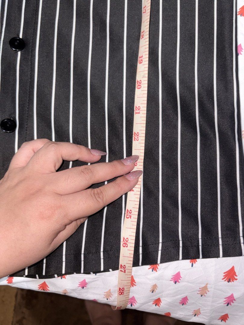 Comme des Garçons Striped short sleeve button down shirt (Category: Shirts) located in Manila. Submitted by fierce_denclutter (Listing ID 1438641783, Image 2). Description: - Black and white striped baseball shirt - Features a red heart patch - V-neck design - Button-up closure - Short sleeves - Length: Approximately 27 inches - Chest width: Approximately 35 inches.