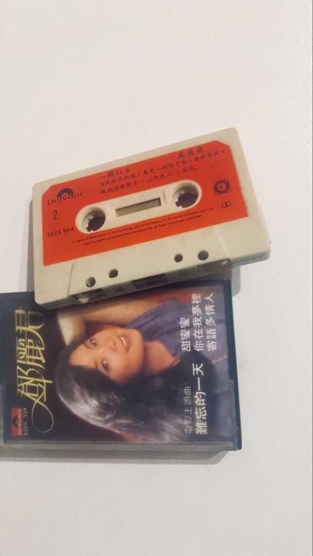 Teresa Teng Cassette Tape (Category: CDs & DVDs) located in Cebu City. Submitted by jazzy333 (Listing ID 1438667565, Image 1). Description: - Vintage Teresa Teng cassette tape - Features popular songs: "Sweet Honey," "Unforgettable Day" - Label: Polydor - Distinctive red and white design - Cover photo of Teresa Teng.