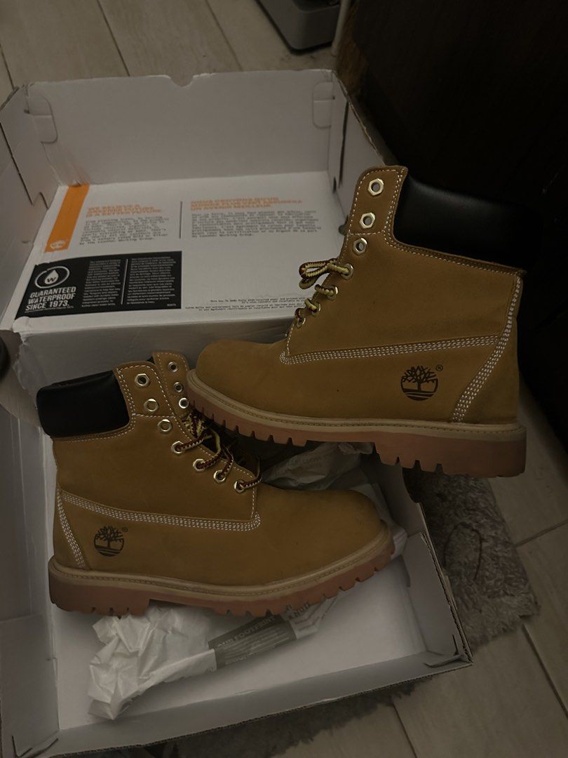 Timberland Premium Waterproof Boots - Wheat Nubuck (Category: Boots) located in Manila. Submitted by zeldeclutter (Listing ID 1438688870, Image 1). Description: - Wheat nubuck leather - Size: 9W - Model: TB 010061 T13 - Includes original box - Classic Timberland design - Waterproof - Suitable for all weather conditions.