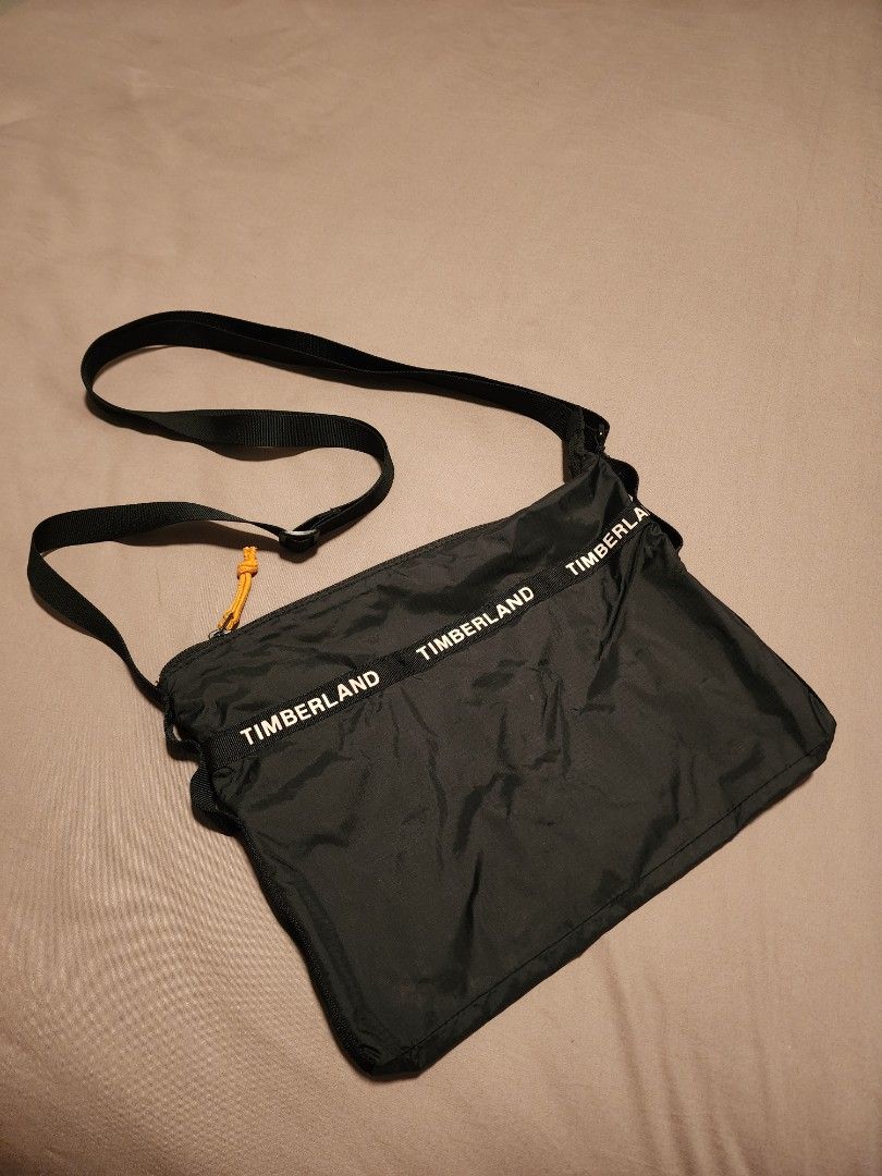 Timberland Sling Bag (Category: Backpacks) located in Singapore. Submitted by thedeclutterstore (Listing ID 1438637452, Image 3). Description: - Features Timberland logo - Includes a shoulder strap - Fanny bag.