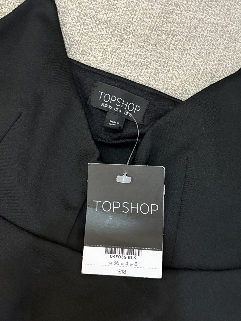 Topshop Black Peplum Top (Category: Sleeveless) located in Pasig City. Submitted by mm__ks888 (Listing ID 1438515090, Image 2). Description: - Brand: Topshop - Style: Peplum top - Features: Spaghetti straps, V-neck - Condition: New with tags.