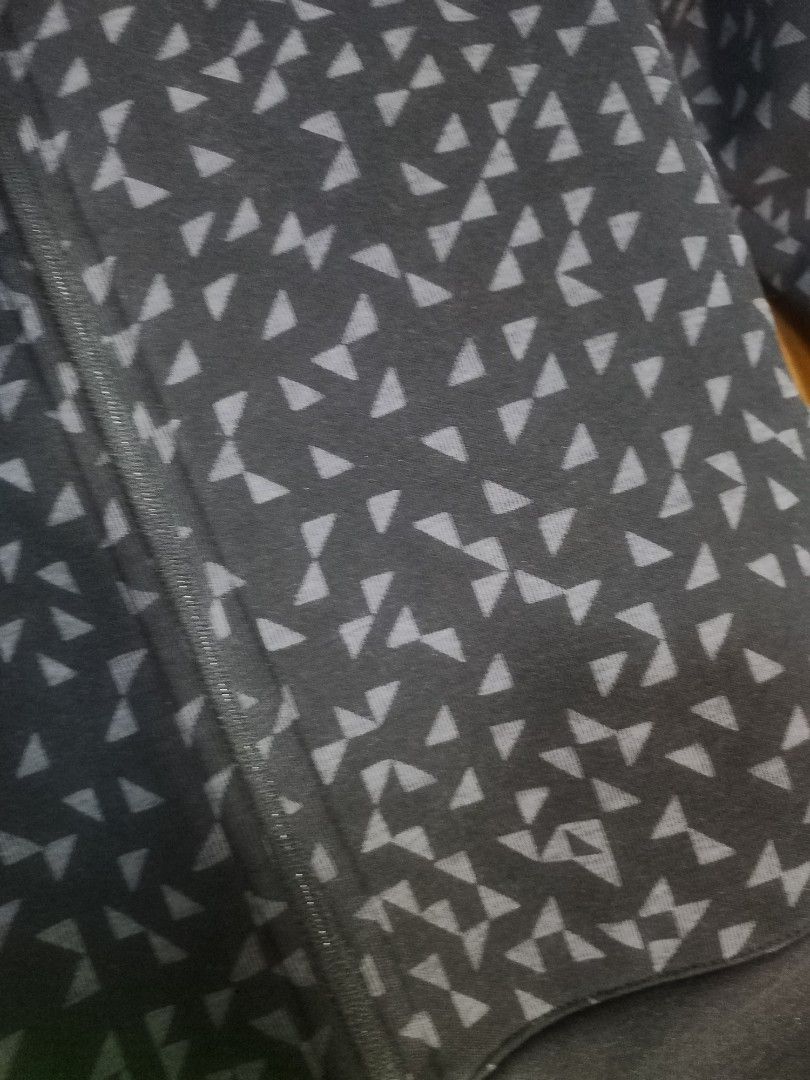 Uniqlo Black Patterned Zip-Up Jacket (Category: Coats, Jackets and Outerwear) located in Manila. Submitted by jochaaa011 (Listing ID 1438658916, Image 2). Description: - Uniqlo black jacket - Unique geometric pattern - Full zip closure - Ribbed cuffs and hem - Comfortable fabric - Versatile for various outfits.