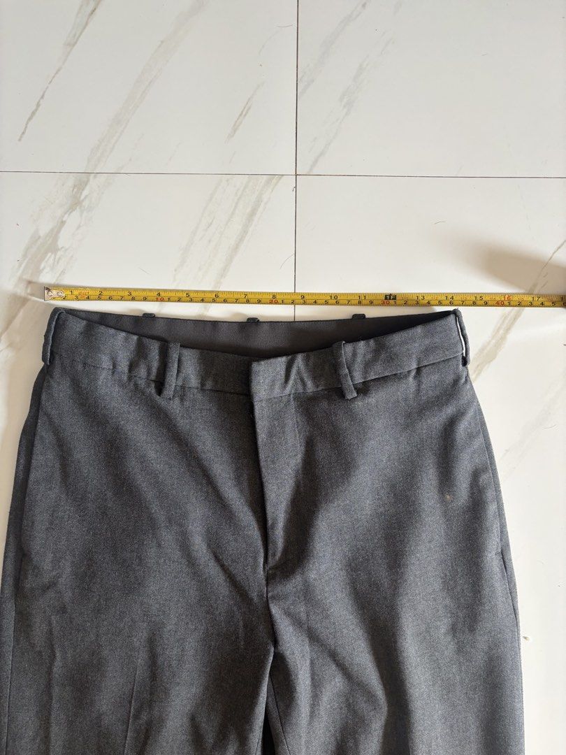 Uniqlo Gray Pants (Category: Trousers) located in Baguio. Submitted by usedcondition (Listing ID 1438691022, Image 3). Description: - Uniqlo gray pants - Size: S - Waist: Approximately 15 inches - Length: Approximately 37 inches - Features: Two front pockets, two back pockets - Material: Polyester, rayon, and spandex blend.