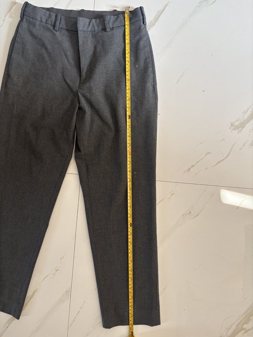 Uniqlo Gray Pants (Category: Trousers) located in Baguio. Submitted by usedcondition (Listing ID 1438691022, Image 2). Description: - Uniqlo gray pants - Size: S - Waist: Approximately 15 inches - Length: Approximately 37 inches - Features: Two front pockets, two back pockets - Material: Polyester, rayon, and spandex blend.