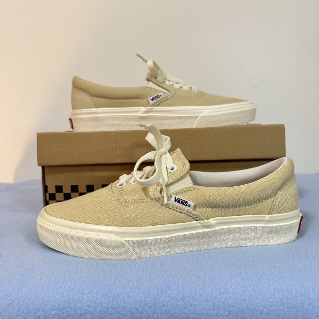 Vans Era Beige Sneakers Slip ons (Category: Sneakers) located in Pasig City. Submitted by r91294 (Listing ID 1438556957, Image 1). Description: - Vans Era sneakers - Beige canvas upper - Lace-up closure - White midsole - Vans logo detail - Includes original box - Size: US Men's 7, Women's 8, 25cm,.