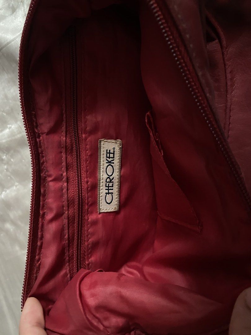 Vintage Cherokee Maroon Red London soft leather hobo handbag (Category: Shoulder Bags) located in San Juan City. Submitted by adore.me (Listing ID 1438522322, Image 3). Description: - Cherokee red shoulder bag - Zippered main compartment - Interior pocket - Single shoulder strap - Decorative hardware - Red interior - Exterior shows wear - Good size for everyday use - issue on last pic.