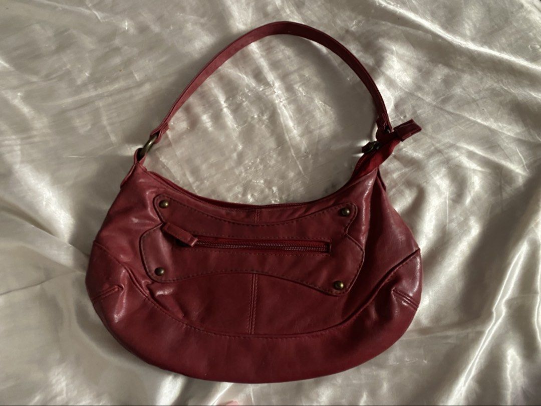 Vintage Cherokee Maroon Red London soft leather hobo handbag (Category: Shoulder Bags) located in San Juan City. Submitted by adore.me (Listing ID 1438522322, Image 1). Description: - Cherokee red shoulder bag - Zippered main compartment - Interior pocket - Single shoulder strap - Decorative hardware - Red interior - Exterior shows wear - Good size for everyday use - issue on last pic.