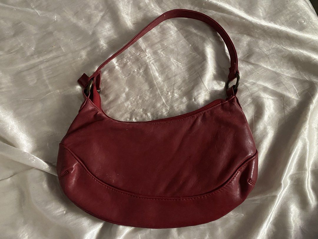 Vintage Cherokee Maroon Red London soft leather hobo handbag (Category: Shoulder Bags) located in San Juan City. Submitted by adore.me (Listing ID 1438522322, Image 2). Description: - Cherokee red shoulder bag - Zippered main compartment - Interior pocket - Single shoulder strap - Decorative hardware - Red interior - Exterior shows wear - Good size for everyday use - issue on last pic.