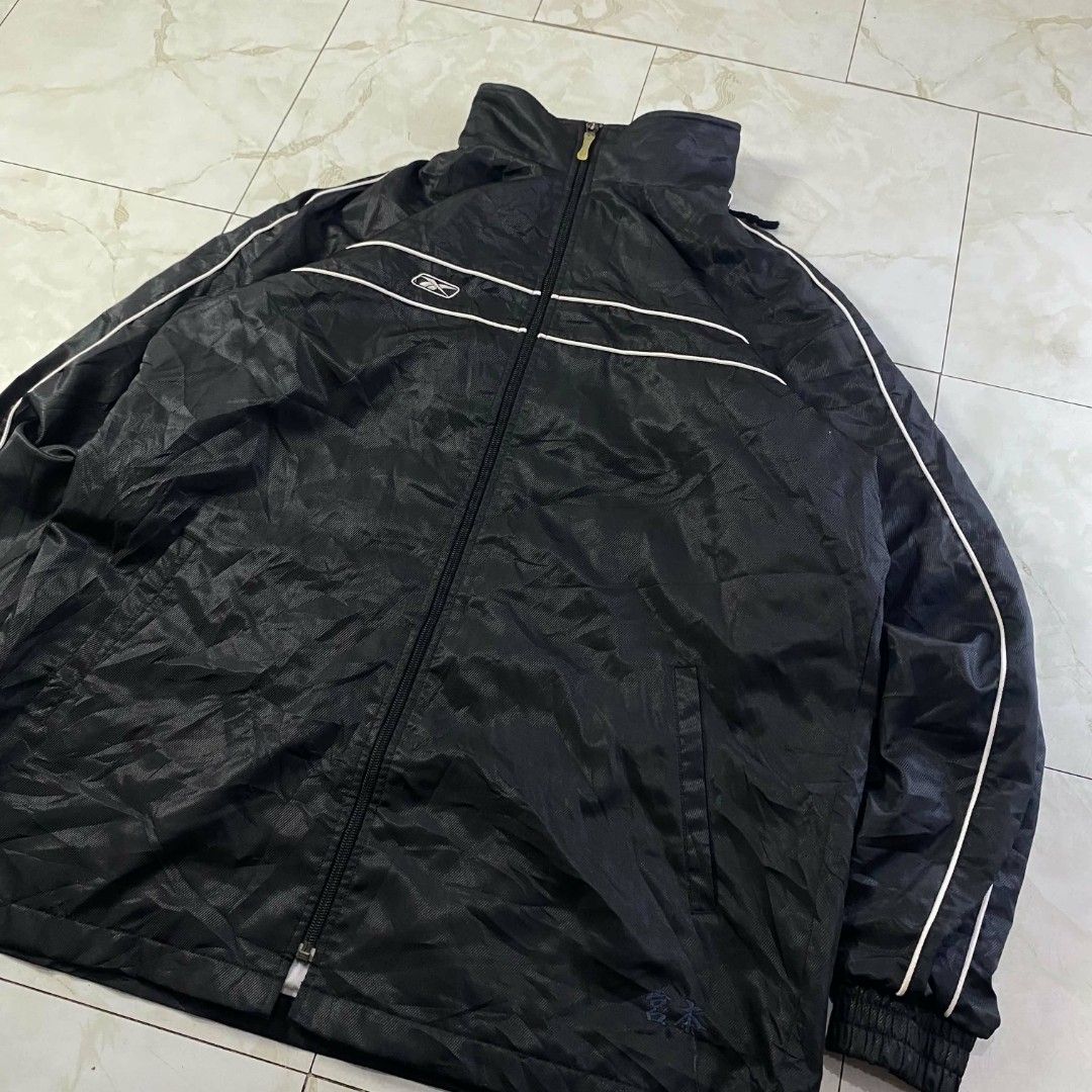 Vintage Y2K Reebok windbreaker (Category: Coats, Jackets and Outerwear) located in Manila. Submitted by jayvee-92b986 (Listing ID 1438538485, Image 2). Description: y2k reebok windbreaker size medium on tag up to large no issue 10/10 color rate.