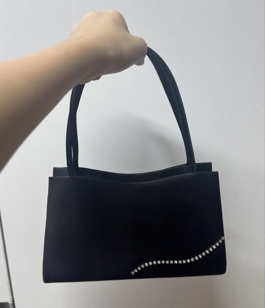 Vintage Y&S Mini Black Purse (Category: Purses & Pouches) located in Paranaque City. Submitted by migvee (Listing ID 1438630429, Image 2). Description: - Black evening bag with a curved design - Satin finish - Sparkling rhinestone embellishment - Includes a rope strap - Features a magnetic snap closure - Has a small inner pocket - Ideal for special occasions Mini vintage design..