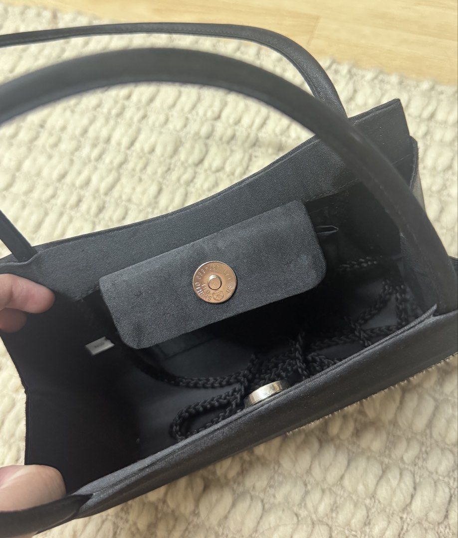 Vintage Y&S Mini Black Purse (Category: Purses & Pouches) located in Paranaque City. Submitted by migvee (Listing ID 1438630429, Image 3). Description: - Black evening bag with a curved design - Satin finish - Sparkling rhinestone embellishment - Includes a rope strap - Features a magnetic snap closure - Has a small inner pocket - Ideal for special occasions Mini vintage design..