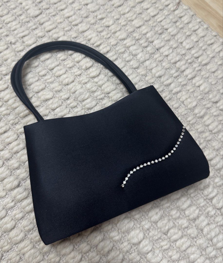 Vintage Y&S Mini Black Purse (Category: Purses & Pouches) located in Paranaque City. Submitted by migvee (Listing ID 1438630429, Image 1). Description: - Black evening bag with a curved design - Satin finish - Sparkling rhinestone embellishment - Includes a rope strap - Features a magnetic snap closure - Has a small inner pocket - Ideal for special occasions Mini vintage design..