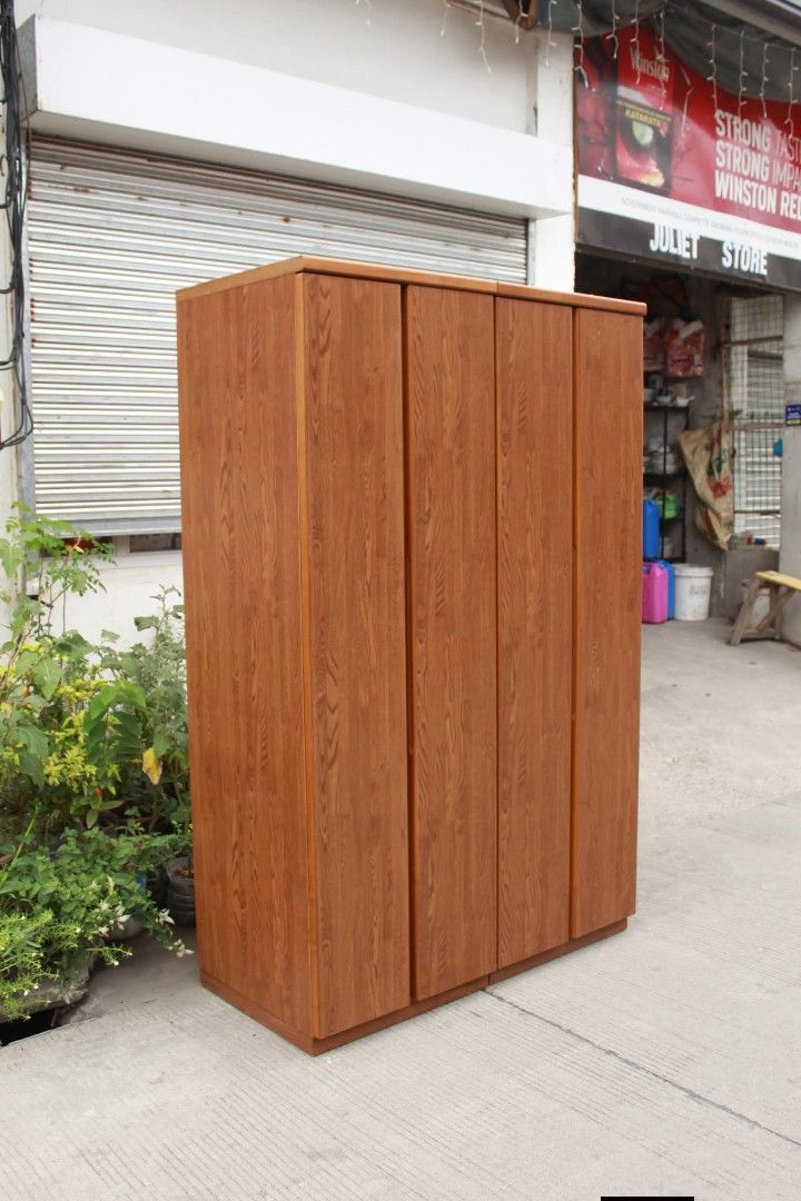 Wardrobe (Category: Shelves, Cabinets & Racks) located in Meycauayan. Submitted by marygracecasimiro (Listing ID 1438624937, Image 3). Description: Wooden Wardrobe Cabinet Can also be separated into two units for easier transport and flexible setup. Built-in hanging rod, adjustable shelves, interior mirror and accessory/towel bars inside the doors. Slim space-saving design, perfect for condos, apartments or small rooms L:47 ½ • W:22 ½ • H:74 ½ in