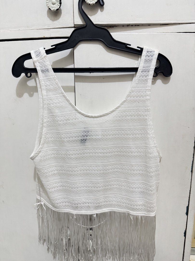 White Fringe Top (Category: Sleeveless) located in Manila. Submitted by karlaportuguez (Listing ID 1438689252, Image 1). Description: - White sleeveless top - Silver fringe detail - Scoop neckline - Textured knit fabric - Versatile for layering - Unique and stylish.