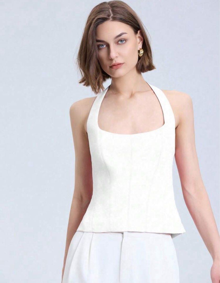 White Halter Top (Category: Sleeveless) located in Makati City. Submitted by ckfer (Listing ID 1438604918, Image 1). Description: - Elegant white halter top - Square neckline - Fitted silhouette - Open back - Perfect for a chic look.