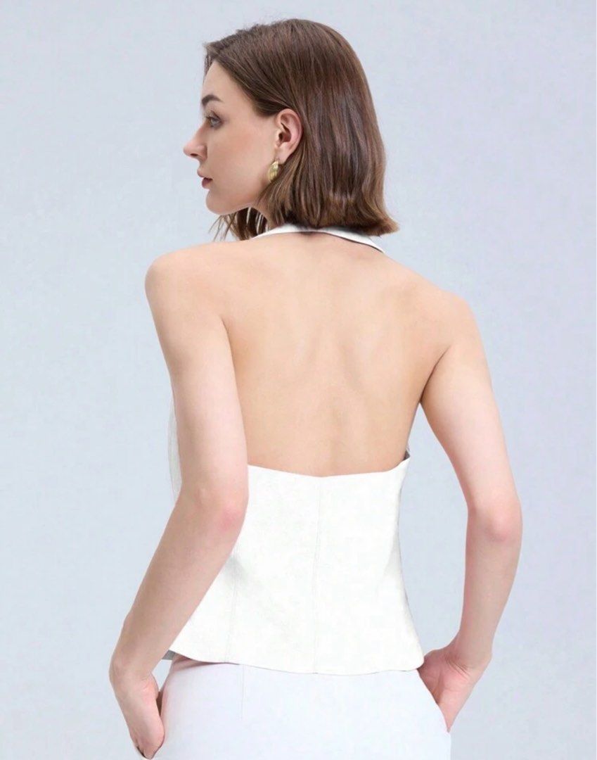 White Halter Top (Category: Sleeveless) located in Makati City. Submitted by ckfer (Listing ID 1438604918, Image 2). Description: - Elegant white halter top - Square neckline - Fitted silhouette - Open back - Perfect for a chic look.