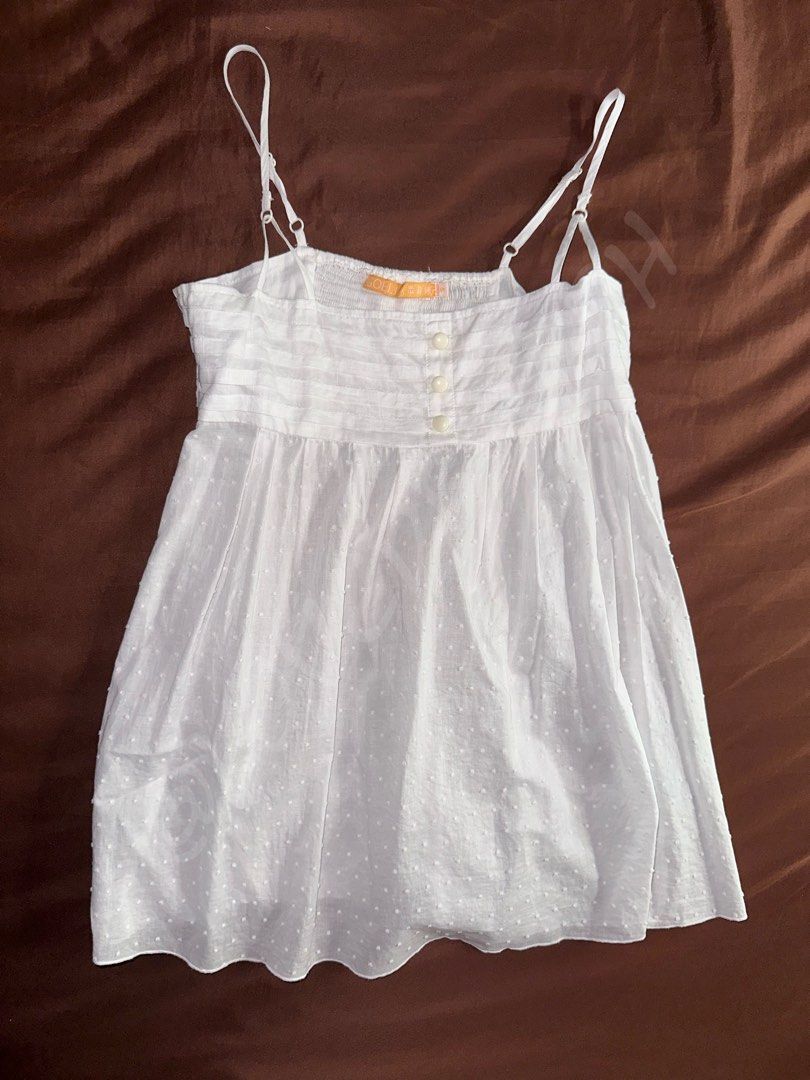 White Sheer Polka Long Peplum Spaghetti Strap Cami Top (Category: Sleeveless) located in Taguig. Submitted by lovedbym.sell (Listing ID 1438564778, Image 1). Description: Fabric is a bit sheer, can be worn as summer oufit. Just wear inner white tube! Bust: 32 in Length (w/o strap): 20 in RFS: decluttering.