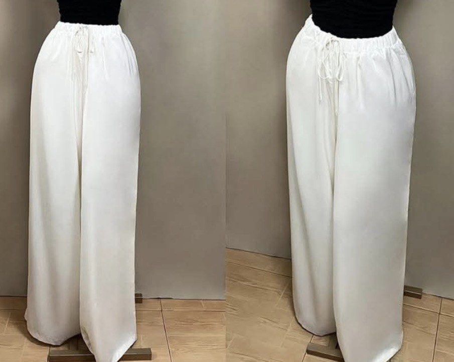 White Wide Leg Pants (Category: Other Bottoms) located in Taguig. Submitted by _rian20 (Listing ID 1438597578, Image 1). Description: - Binili pero di ginamit hahahah😭 - Pang dagat sana or cover up pwede din🌬️🩷 - Keep na lang kung walang may bet - Good as new talaga - White wide-leg pants - Drawstring waist - Relaxed, flowy fit - Lightweight fabric - Perfect for warm weather - Dress up or down.