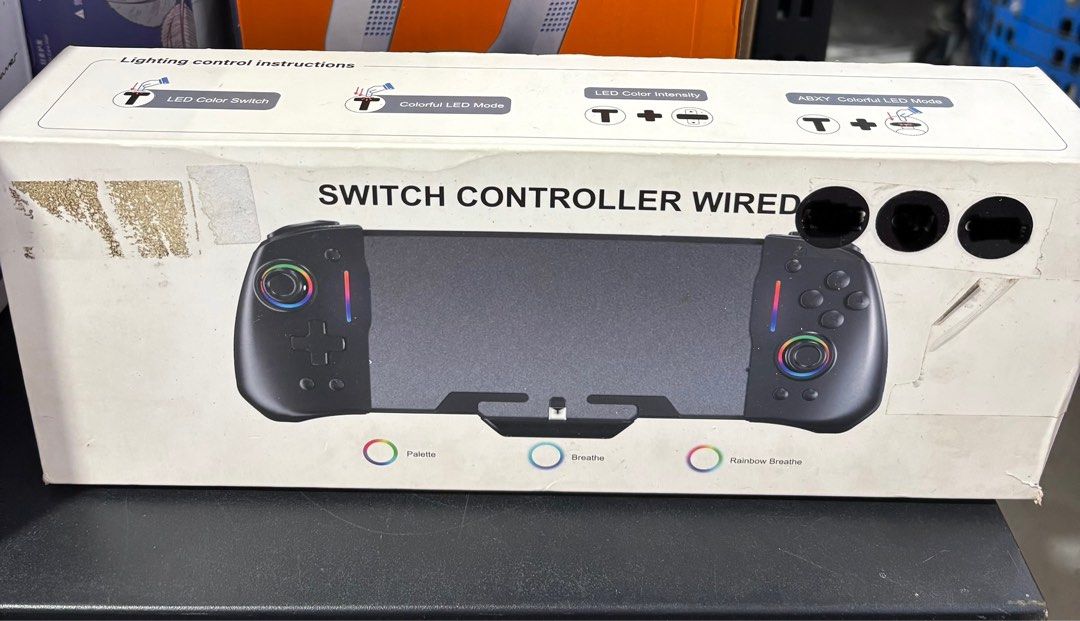 Wired Switch Controller with LED (Category: Controllers) located in Kajang. Submitted by floveanggun (Listing ID 1438656813, Image 1). Description: - Wired controller for Nintendo Switch. - Features LED lighting control. - Color switch option. - Multiple LED modes: colorful, palette, breathe, rainbow breathe. - ABXY colorful LED mode. - Adjustable LED color intensity..