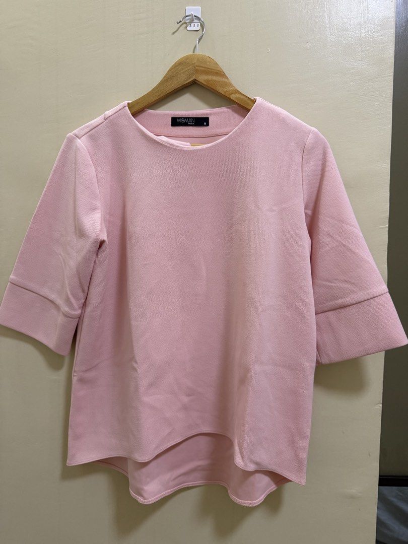 Woman Pink Blouse (Category: Blouses) located in Bulacan. Submitted by issajimm83879 (Listing ID 1438542459, Image 1). Description: - Brand: Woman - Style: Blouse - Color: Pink - Neckline: Round - Sleeves: 3/4 length - Hemline: Curved - Features: Solid pink color - Condition: Size tag visible.