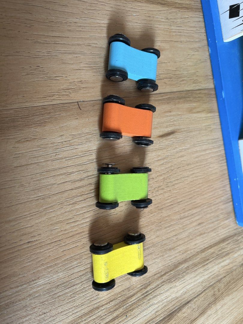 Wooden Race Track Toy (Category: Educational & Learning Toys) located in Quezon. Submitted by smallville.ph (Listing ID 1438563199, Image 2). Description: - Wooden race track with numbered lanes - Includes colorful cars (blue, orange, green, yellow) - Features a checkered flag design - Made of wood - Ideal for young children.