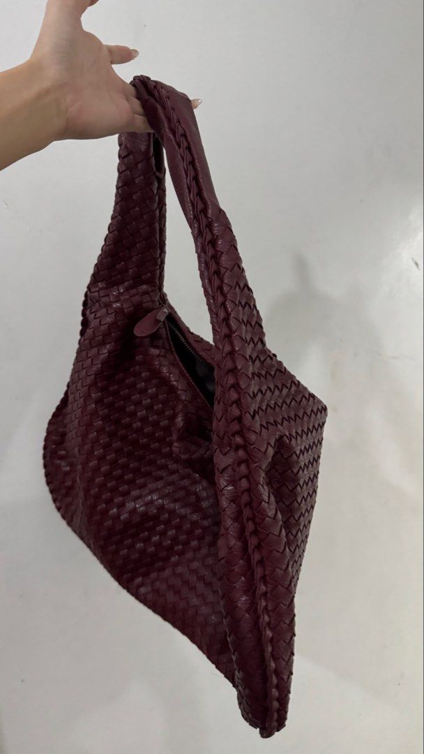 Woven Shoulder Bag - Burgundy (Category: Shoulder Bags) located in Paranaque City. Submitted by caseycunanan (Listing ID 1438571859, Image 2). Description: - Burgundy woven shoulder bag - Braided strap - Zippered main compartment - Interior zippered pockets - Soft, slouchy shape - Woven exterior pattern.