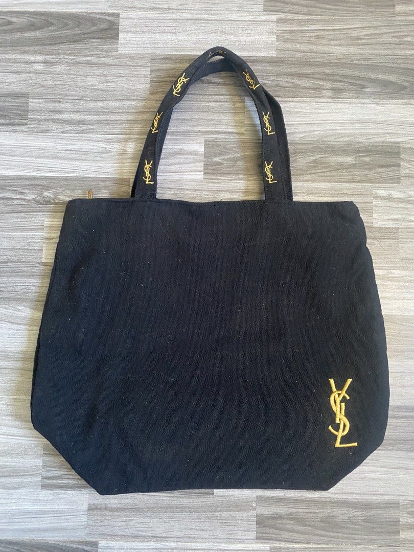 YSL BLACK CANVAS HAND BAG (Category: Luxury Bags & Wallets) located in Antipolo. Submitted by marcoandpaolomerchandise (Listing ID 1438589649, Image 1). Description: YSL Branded Canvas No etiquette Naka YSL sa Puller & Mini Pocket inside Semi Med size Ang Ganda sa Actual Pwede gawing Sosyal na baunan 😅 Or yung mahilig lang sa small bag Preloved Good Condition Need ng wash due to storage. NAALIKABUKAN lang May konting dot sa puller due to stock ,