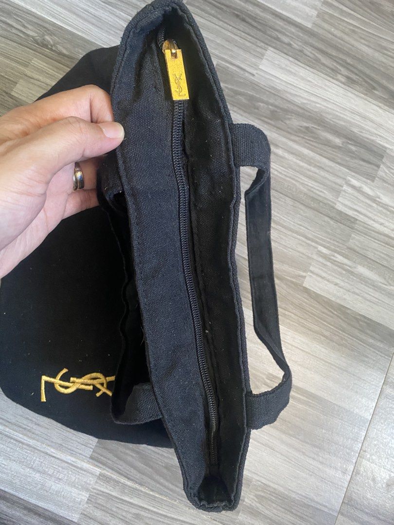 YSL BLACK CANVAS HAND BAG (Category: Luxury Bags & Wallets) located in Antipolo. Submitted by marcoandpaolomerchandise (Listing ID 1438589649, Image 3). Description: YSL Branded Canvas No etiquette Naka YSL sa Puller & Mini Pocket inside Semi Med size Ang Ganda sa Actual Pwede gawing Sosyal na baunan 😅 Or yung mahilig lang sa small bag Preloved Good Condition Need ng wash due to storage. NAALIKABUKAN lang May konting dot sa puller due to stock ,